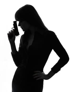one caucasian sexy detective  woman holding aiming  gun in silhouette studio isolated on white background