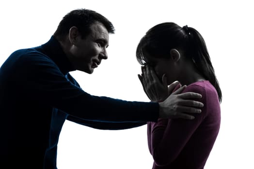 one caucasian couple woman crying man consoling  in silhouette studio isolated on white background
