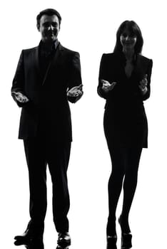 one caucasian couple business woman man in silhouette studio isolated on white background