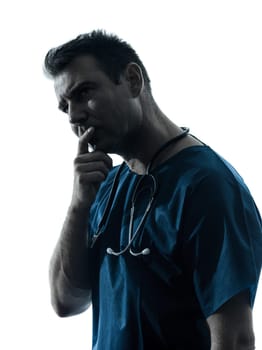 one caucasian man doctor surgeon medical worker  thinking pensive silhouette isolated on white background