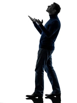 one causasian man full length in silhouette studio isolated on white background