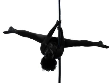 one caucasian woman pole dancer dancing in silhouette studio isolated on white background