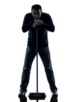 one causasian man janitor brooming cleaner boredom full length in silhouette studio isolated on white background