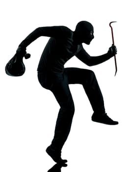 thief criminal terrorist in silhouette studio isolated on white background