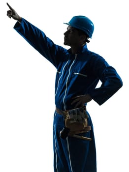 one caucasian man construction worker pointing showing silhouette portrait in studio on white background