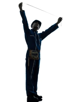 one caucasian man construction worker pointing showing silhouette portrait in studio on white background
