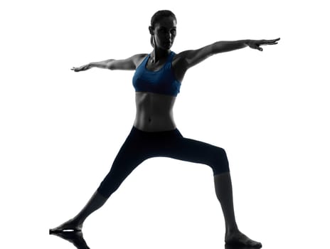one caucasian woman exercising yoga in silhouette studio isolated on white background