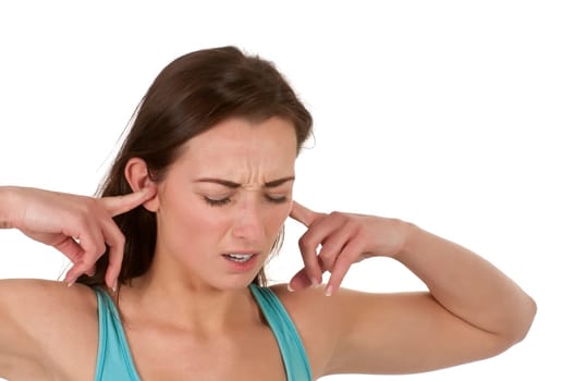 young woman covers her ears