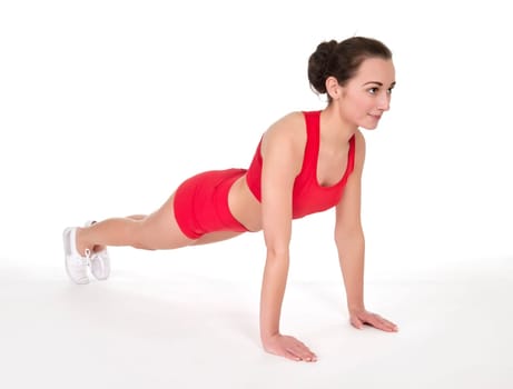 Young woman showing push-ups