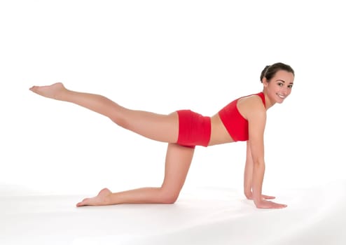 Young woman showing gymnastics exercise