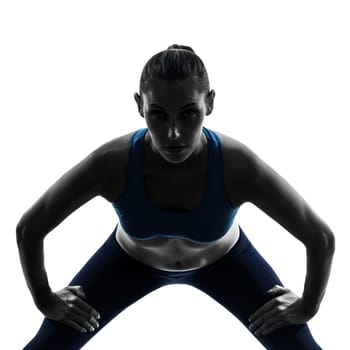 one caucasian woman exercising yoga in silhouette studio isolated on white background
