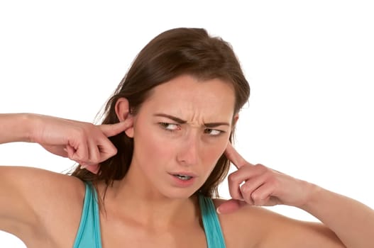 young woman covers her ears