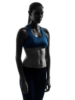 one caucasian woman exercising yoga portrait in silhouette studio isolated on white background