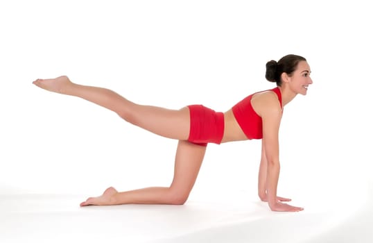 Young woman showing gymnastics exercise