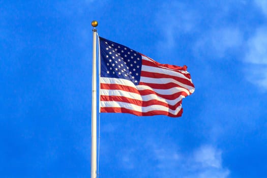 Flag of the United States of America on flag pole