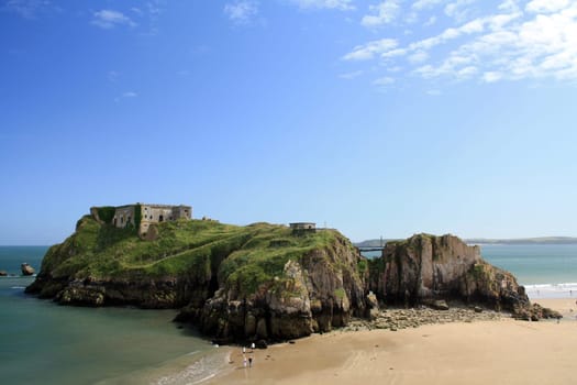 Summer low tide view of the Saint Catherine Island and South Beach at Tenby, Wales.