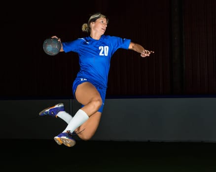 Handball player in jump throw
