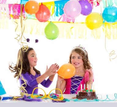 children happy birthday party girls with balloons and chocolate cake