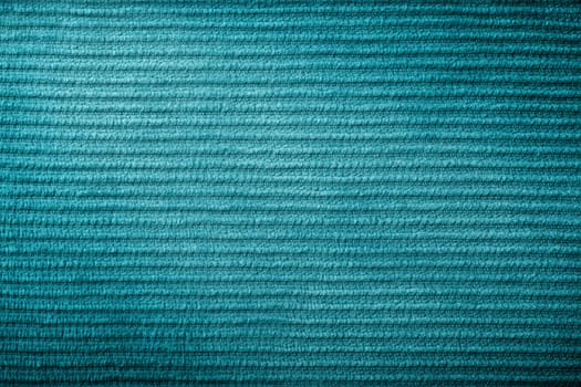 Green corduroy fabric texture for background. Macro shot
