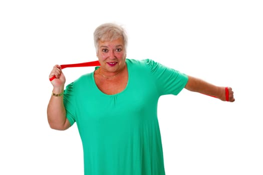 Senior woman with stretch band doing sports - isolated on white background