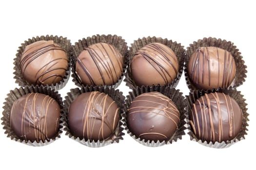 Group of Eight Dark and Milk Chocolate Truffles Bonbon Isolated on White Background