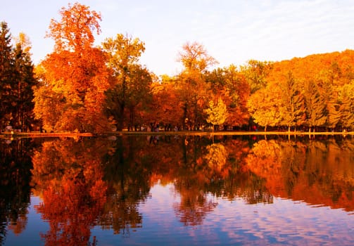 Beautiful colors of autumn landscape by the lake