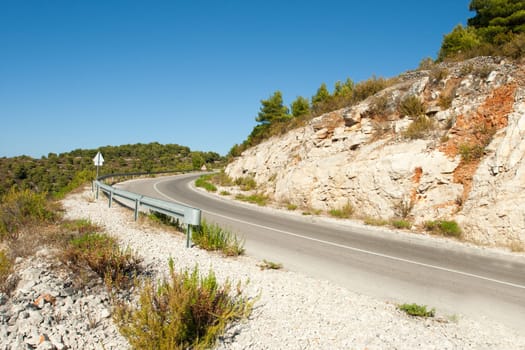 winding road in deserted landscape in vis island