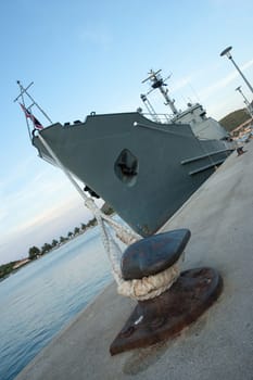 steel bollard with strong ship rope of a military ship