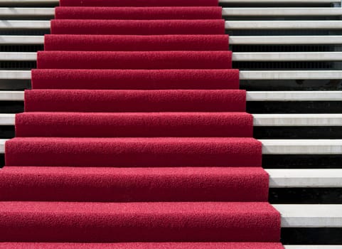 stair with red carpet in front of an hotel