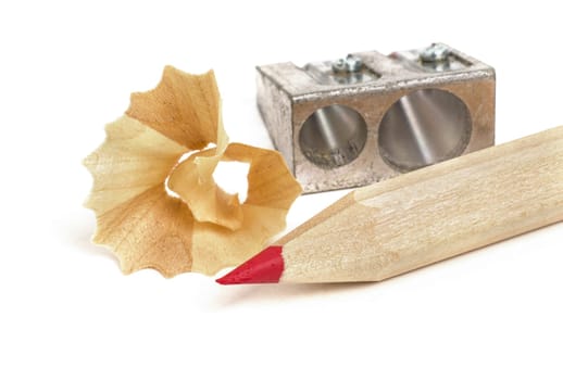 red coloured pencil with sharpener