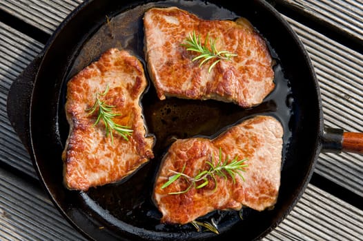rump steaks in the frying pan