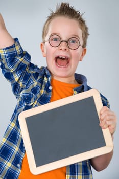 happy boy with little blackboard