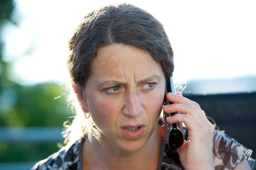 woman has a seriousness telephone call