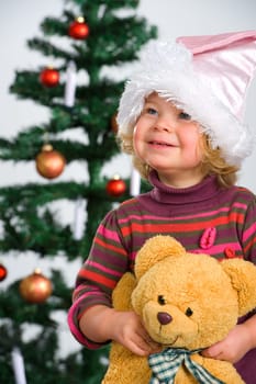 girl in front of christmas-tree