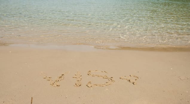 Vis word in the sand at the beach