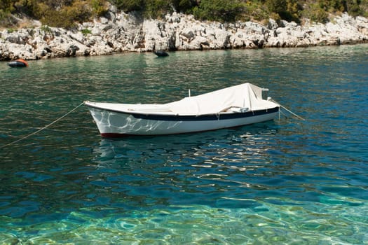 Small white boat on the scenic sea