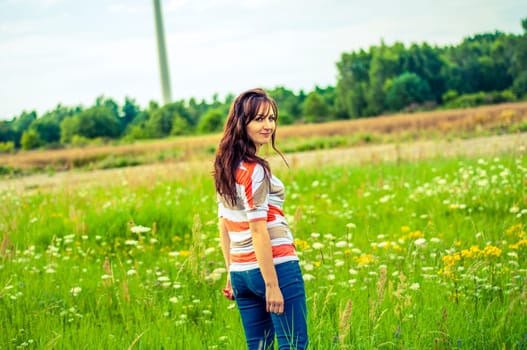 Outdoors portrait of beautiful young brunette girl