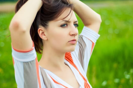 Outdoors portrait of beautiful young brunette girl