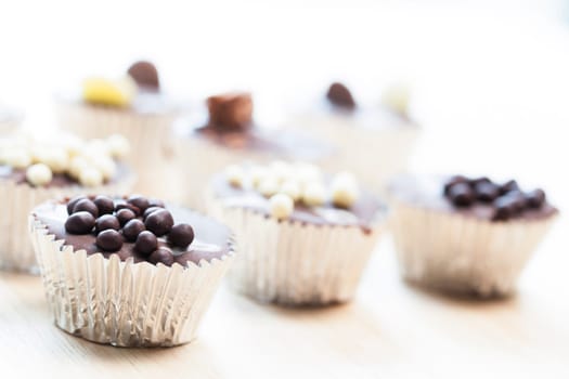 Gourmet chocolate cupcakes in silver cupcake wrappers