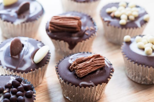 Gourmet chocolate cupcakes in silver cupcake wrappers