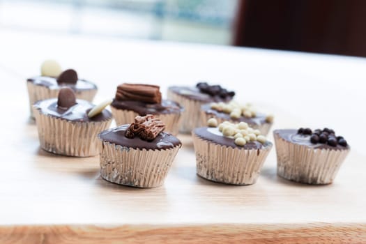 Gourmet chocolate cupcakes in silver cupcake wrappers