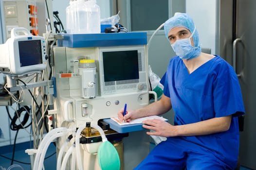 Anesthesiologist in Front of Anesthetic Machine