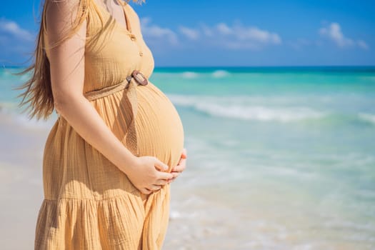 Radiant and expecting, a pregnant woman stands on a pristine snow-white tropical beach, celebrating the miracle of life against a backdrop of natural beauty.