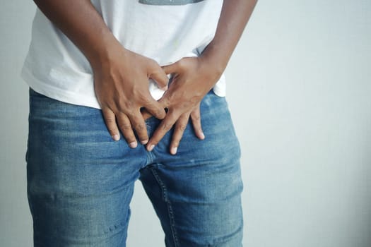 the concept of prostate and bladder problem, crotch pain of a young person .