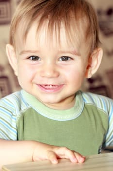 smile little boy with first two tooths