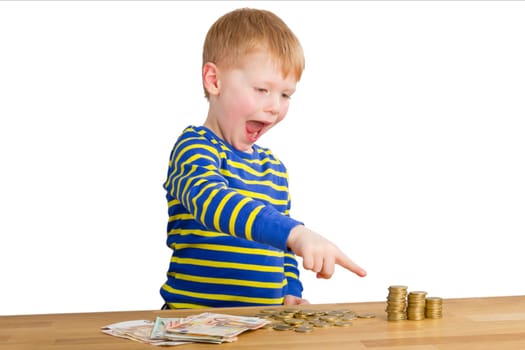 Boy points in amazement at money towers