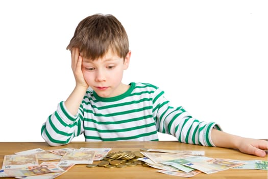 Boy amazed at a lot of money - coins and notes