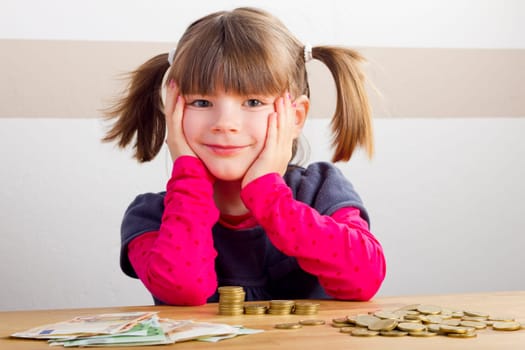 Child is happy about a lot of money