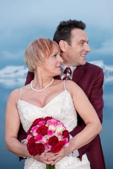 Upper body shot in profile of a bride and groom