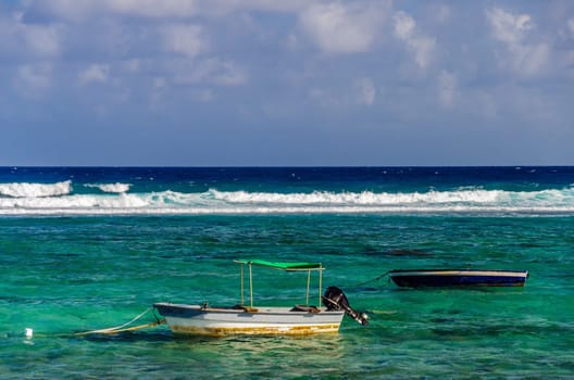 Boats and beautiful turquoise Caribbean Sea water in Colombia.